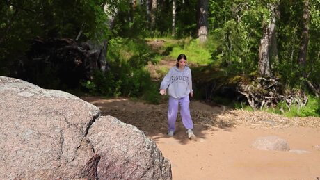 Brunette girl Sophie Weben takes a badly needed piss on a beach