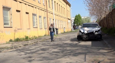 Blonde chick Morena squats afore a car for an urgent pee on a public road