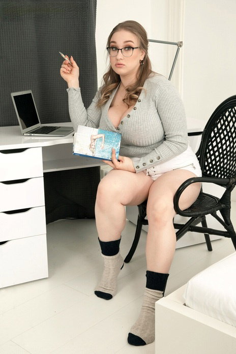 Chubby Russian babe Cheryl Blossom flaunts her big tits during a striptease