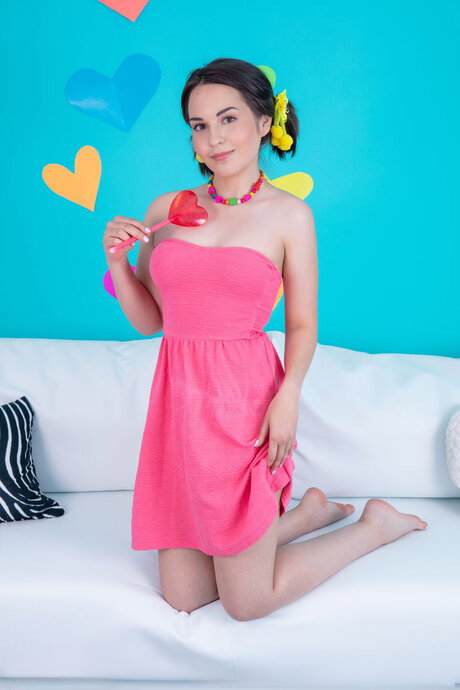 Sweet teen Mi gets completely naked while holding a heart-shaped spoon