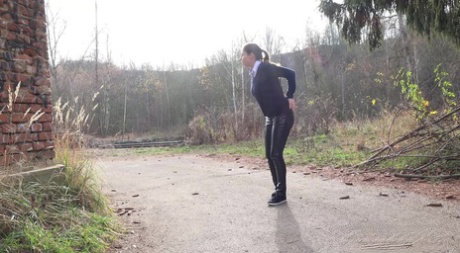 White girl Antonia Sainz pulls down her pants to pee on a road
