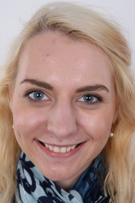 Blonde amateur Marie stands fully clothed and then bare naked as well