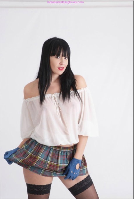 Dark haired girl Sammi Jo exposes her nice tits in leather gloves and a skirt