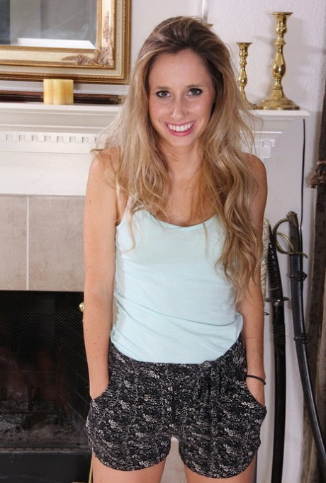 Teen first timer takes off her clothes on carpet in front of unlit fireplace
