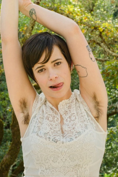 Sexy amateur Freya Mars unveils her hairy pussy in a hot outdoor striptease