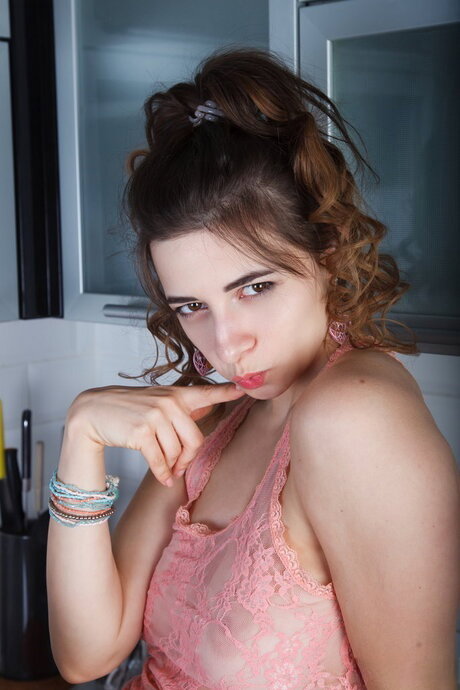 Skinny teen Elle Mira gets completely naked on a kitchen counter