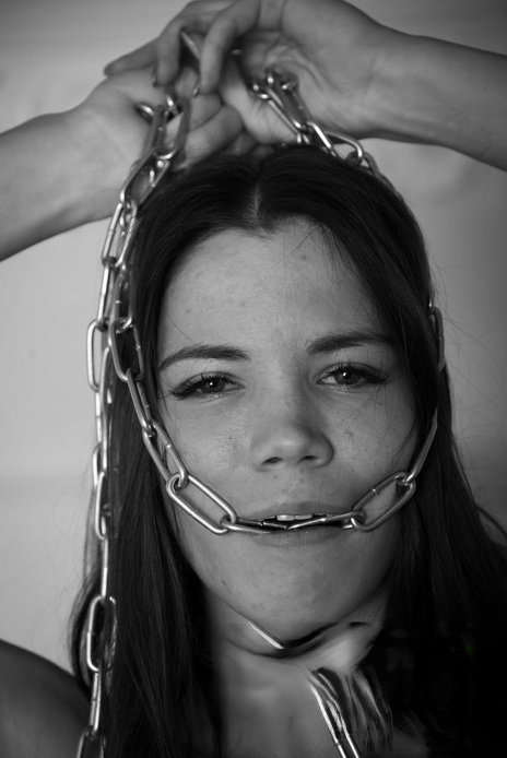 Young beauty April paddles her bare ass during solo BDSM play
