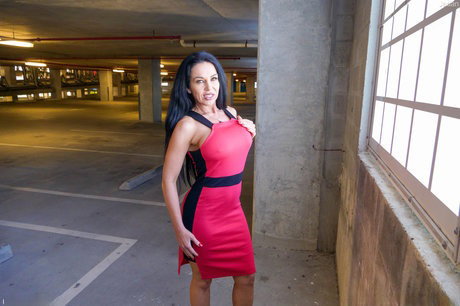 Raven-haired mature lady Jadan flashes her big tits, pussy & ass in the garage