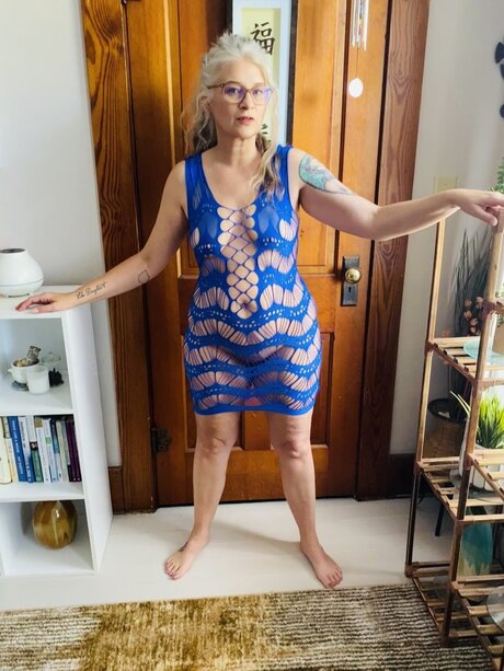 Older blonde Lil Ms Muffet removes a revealing dress to go nude in glasses