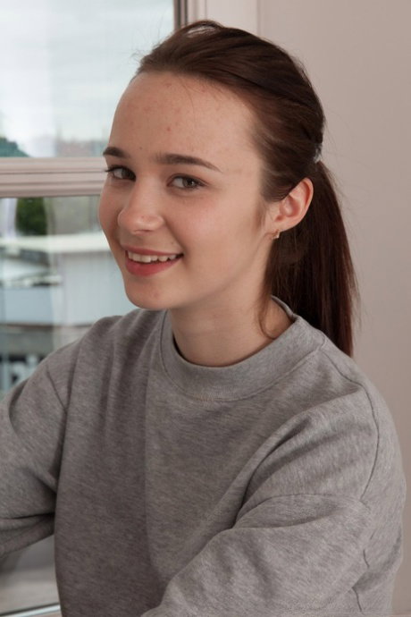 Amateur teen Julia Moore unveils her hairy muff and stretches it