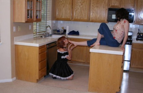 Brunette chick has her toes licked and sucked by her redheaded maid