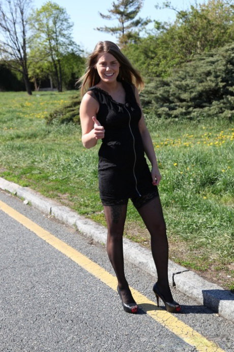 Hot teen in stockings Paula Ven gives a handjob to a stranger between 2 trucks