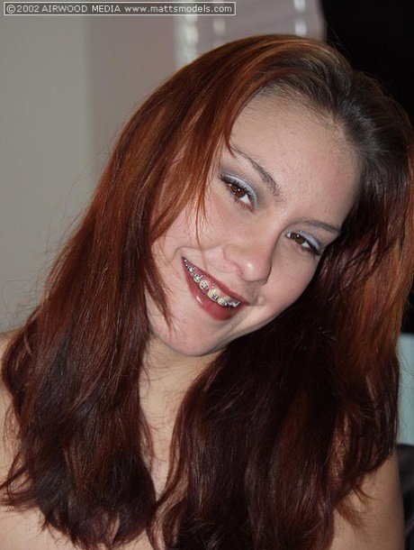 Redheaded girl Chloe parts her pussy lips during her first nude session