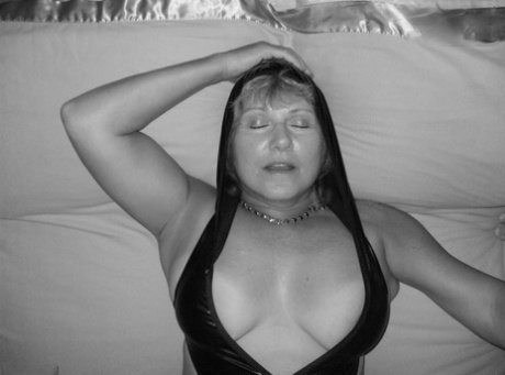 Mature woman Busty Bliss is handcuffed before showing her big natural tits