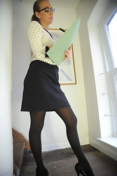 Hot UK blonde Hayley Marie Coppin lets her hair down in a girdle and stockings