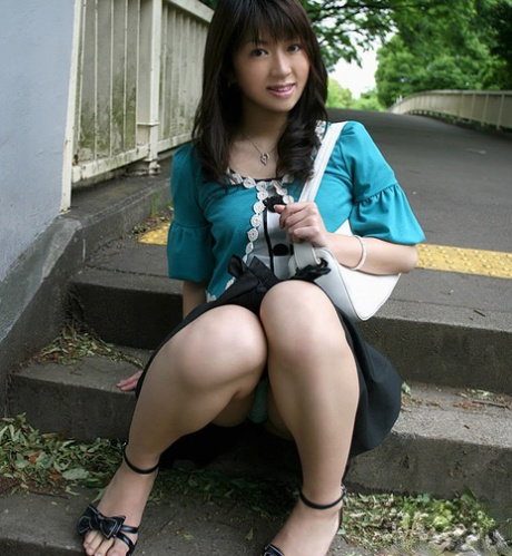 Frisky asian babe revealing her nice tits with hard nipples