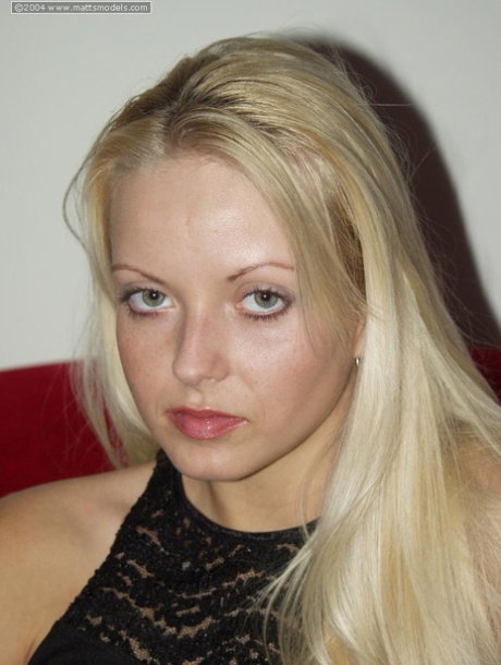 Blonde amateur Jana toys her pink slit after getting naked on red couch