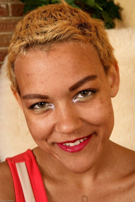 Cute teen with short hair and red lips shows her natural pussy for the first tim