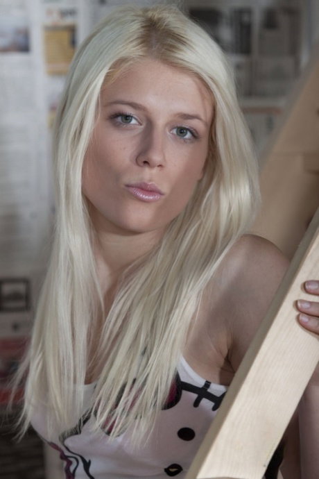 Platinum blonde model Sweet Cat displays her smiley face in her underwear