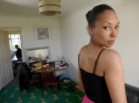 Ebony amateur Sade Rose disrobes to mesh stockings for a clothed business man