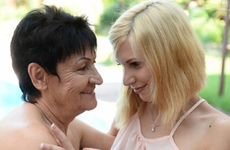 Blonde teen Candy Sweet engages in lesbian intercourse with granny Anastasia
