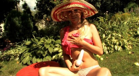Sweet babe with natural tits Vika C masturbates with a sex toy outdoors