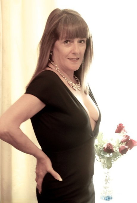 Attractive older mature Pandora peels black dress for hard nipples closeup