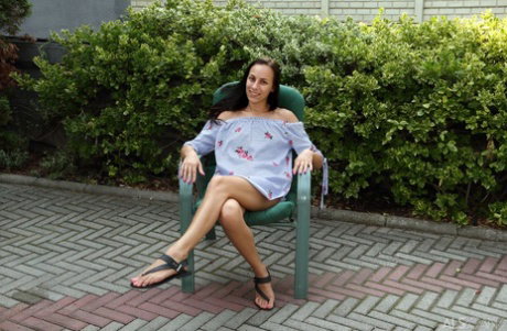 Amateur chick Cayenne Hot pees in the driveway after toying her asshole