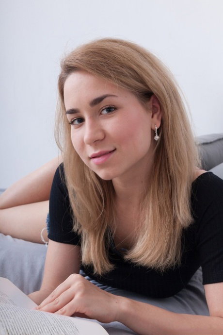 Amateur Russian Nara Abel gets naked & masturbates her hairy pussy on the bed