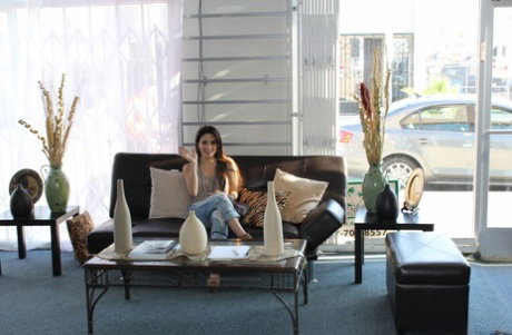 Brown haired cute girl Cara takes off her tight jeans and shows her butt