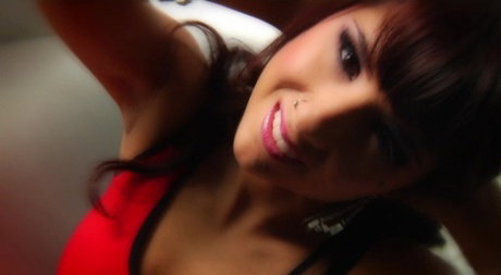 Sexy brunette Evi Fox takes a cumshot on pursed lips after a fuck