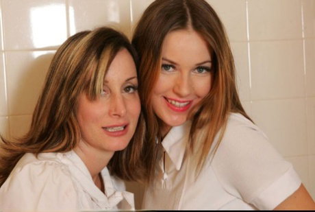 Kinky lesbians in nylon stockings taking a bath in their clothes