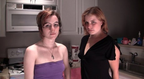 Lesbian girls Dahlia & Lily indulge in piss play during kitchen sex