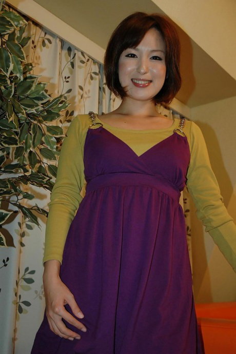 Asian teenage sweetie Kazumi Shindou undressing and playing with her toys