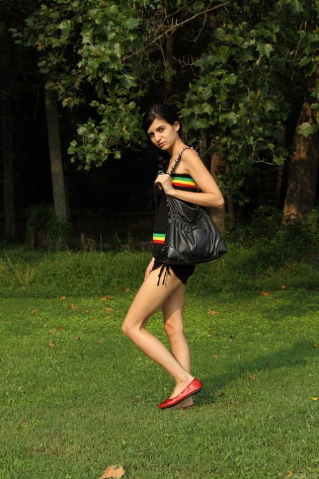 Skinny amateur Zoey Kush takes off her clothes before masturbating in a field