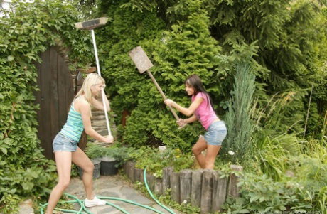 Young girls have lesbian sex on a garden patio after an argument