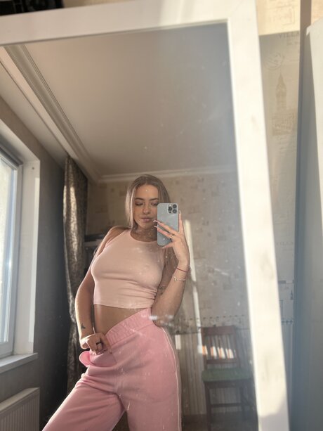Busty OnlyFans model Ketty Moon posing provocatively in her compilation