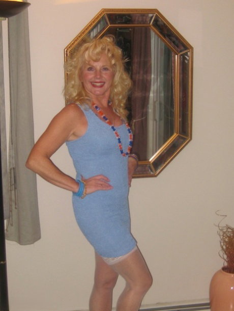Older blonde with curly hair Ruth pegs a man after sucking his small cock