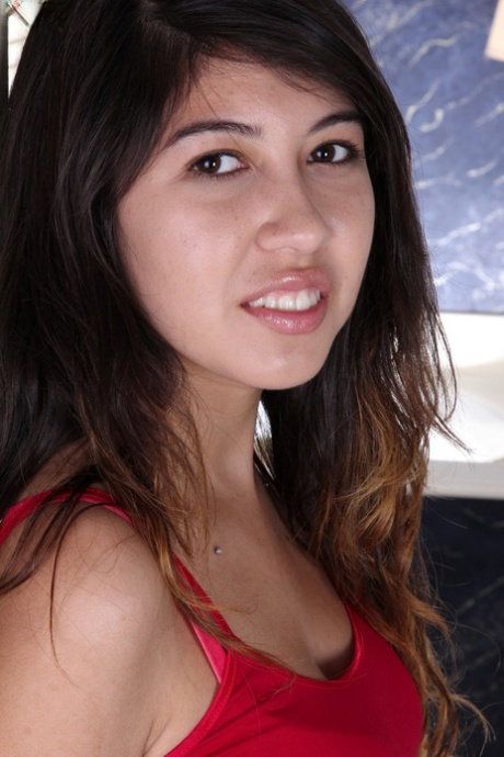 Adorable teen Lucy James shows her holes with her legs up in the air