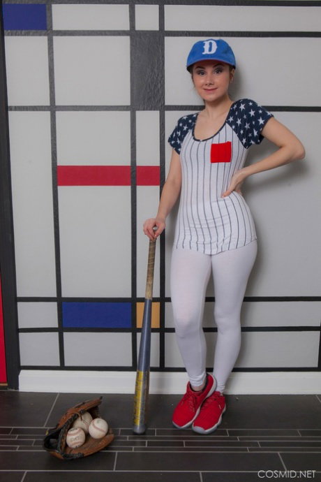 Busty girl Scarlett Jo takes off her baseball uniform to model naked in a cap