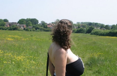 British amateur Denise Davies unleashes her giant boobs out by the woods