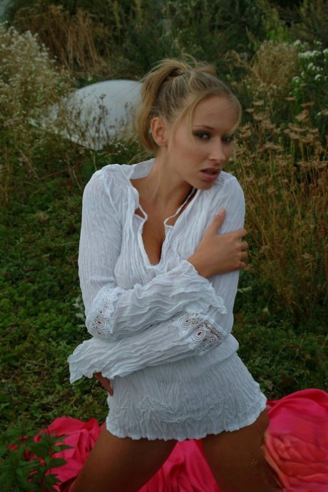Czech babe Roxy Carter flaunts her lovely tits in a sexy outdoor striptease