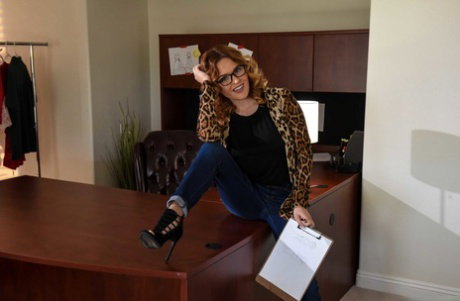 Short MILF Krissy Lynn strips and displays her curves on the office desk