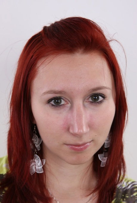 Redhead amateur Monika takes a seat on a stool after standing naked