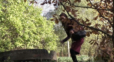 Nice girl Kristyna takes a badly needed piss in black over the knee socks