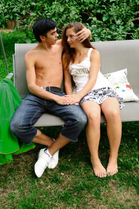 Young amateur receives a facial cumshot after sex on a garden swing