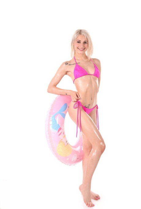 Skinny blonde Christy White discards her bikini before masturbating with a toy