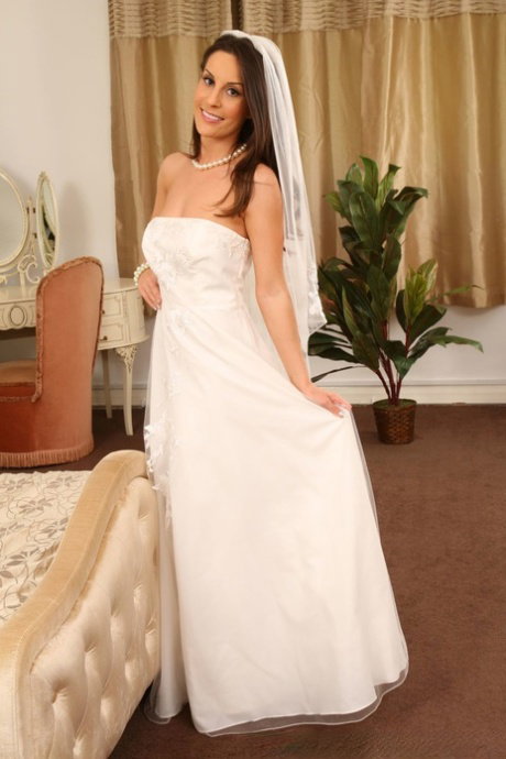 Bride with nice titties Emily J strips her wedding dress and poses in lingerie