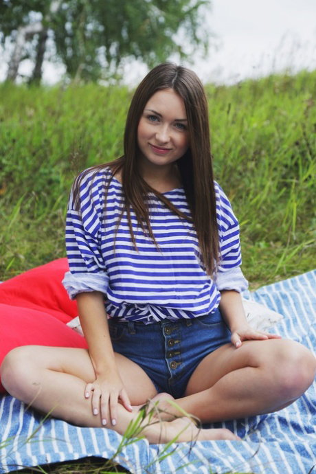 Young girl Alexa Day gets completely naked on a blanket outdoors