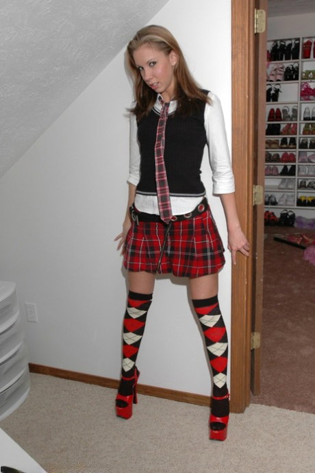 Amateur model shows her cute panties in OTK argyle socks and red heels